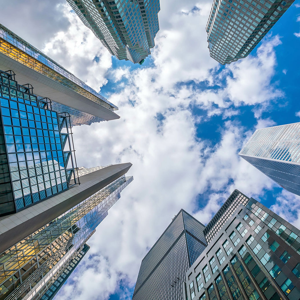 Looking up shot of downtown financial district with skyscrapers, Cloud & Infrastructure | DXC Technology Insights