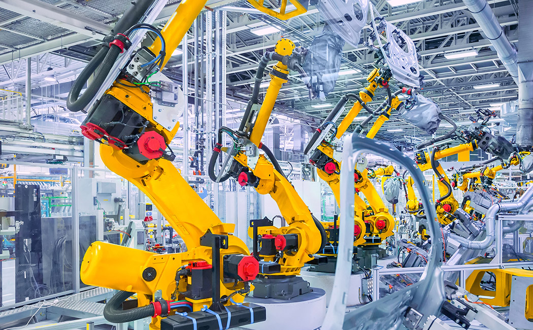 Robotic arms on an assembly line, Manufacturing | DXC Technology