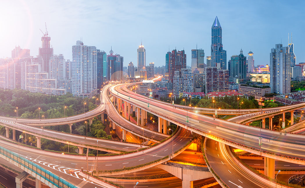 highways in front of cityscape, IBM | DXC Technology