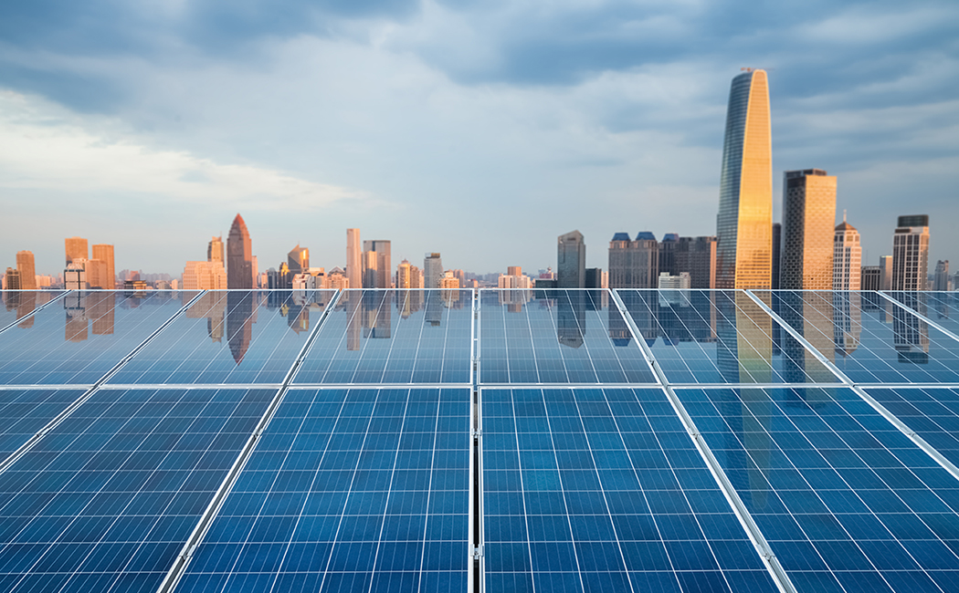 city skyline with solar panels, heritage software, Assure Commercial and Specialty | DXC Technology