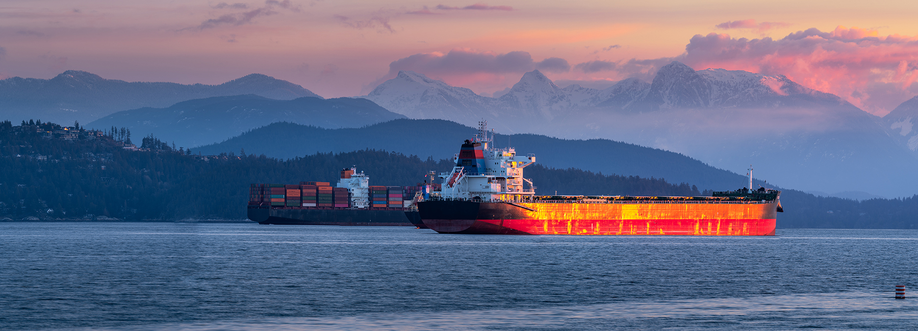 Large orange barge at sea, Assure Commercial and Specialty | DXC Technology