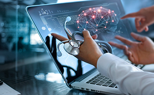 Doctor with stethoscope pointing to brain data on laptop, Data & AI, Healthcare | DXC Technology Insights