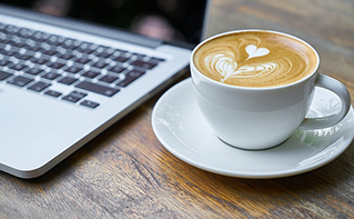 laptop and coffee cup, to deliver value with digital agents, Contact Center Experience | DXC Technology Insights