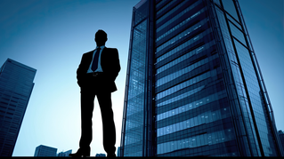 man in front of building in city | DXC Technology Insights